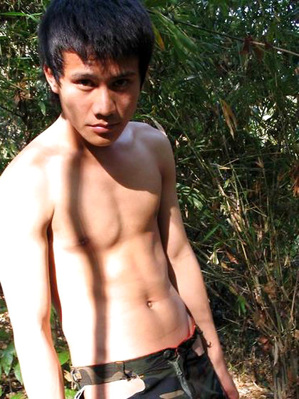 Handsome Thai guy gets naked in the wild
